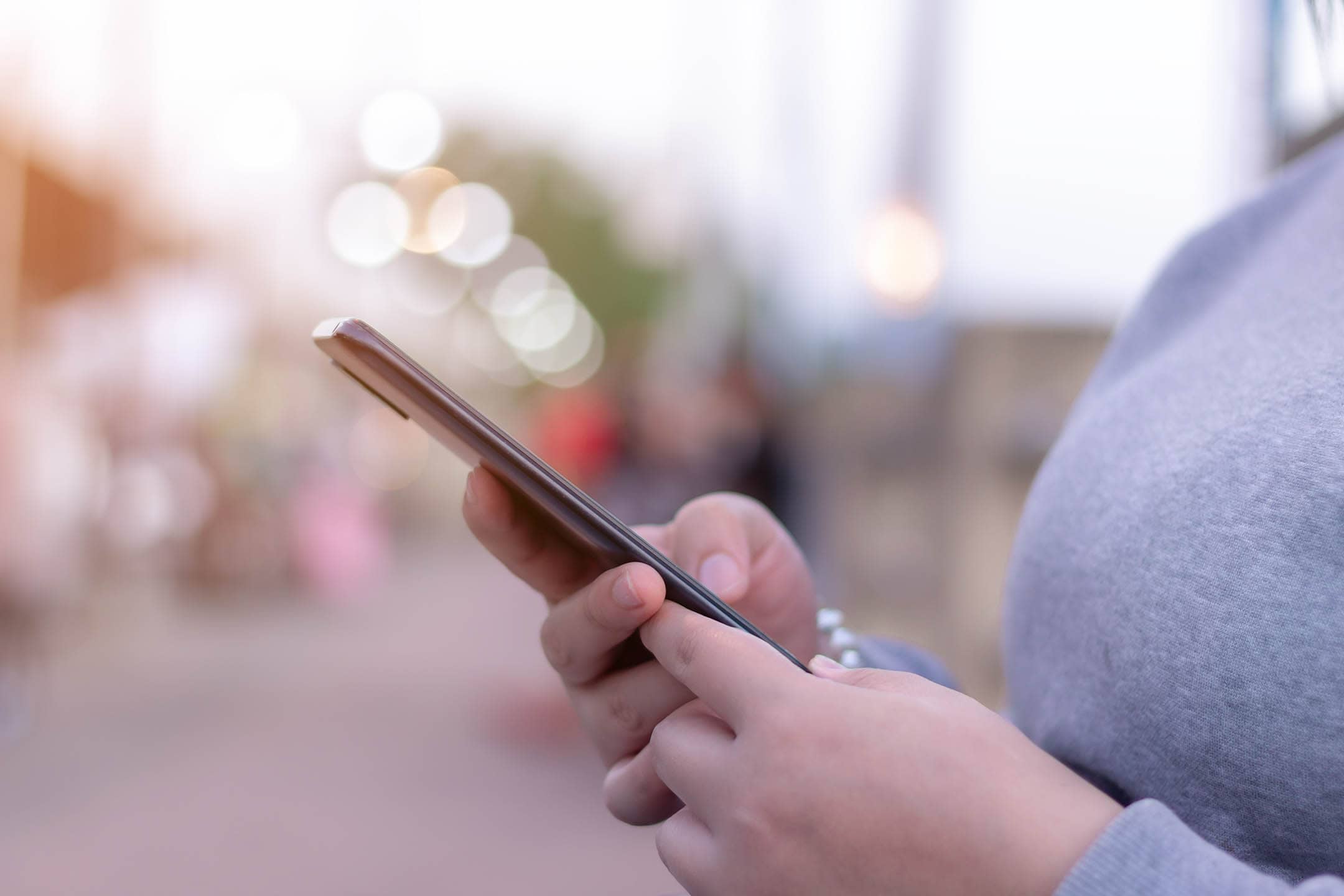 Close up of a lady using a mobile phone